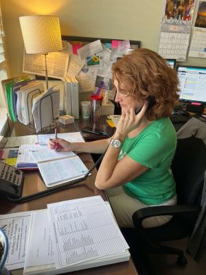 Trisha LaPointe working at her desk.